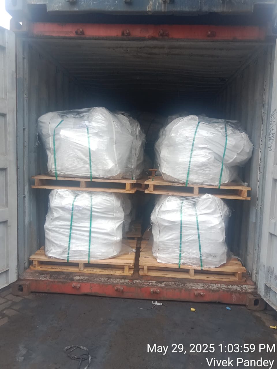 Jumbo bags on wooden pallets, strapped, inside a container